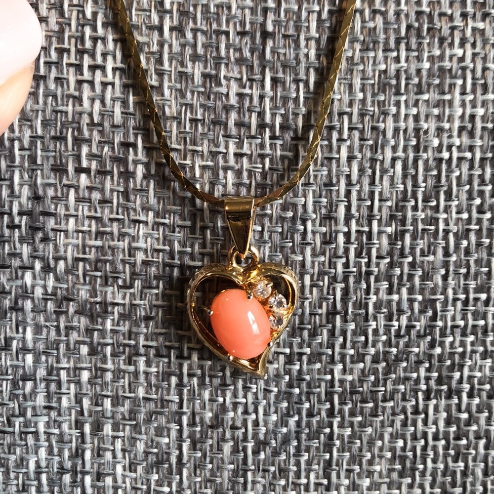 Delicate gold tone heart necklace with rhinestones